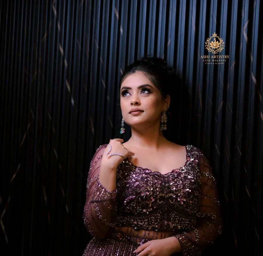 Editorial portrait in a maroon sequinned gown