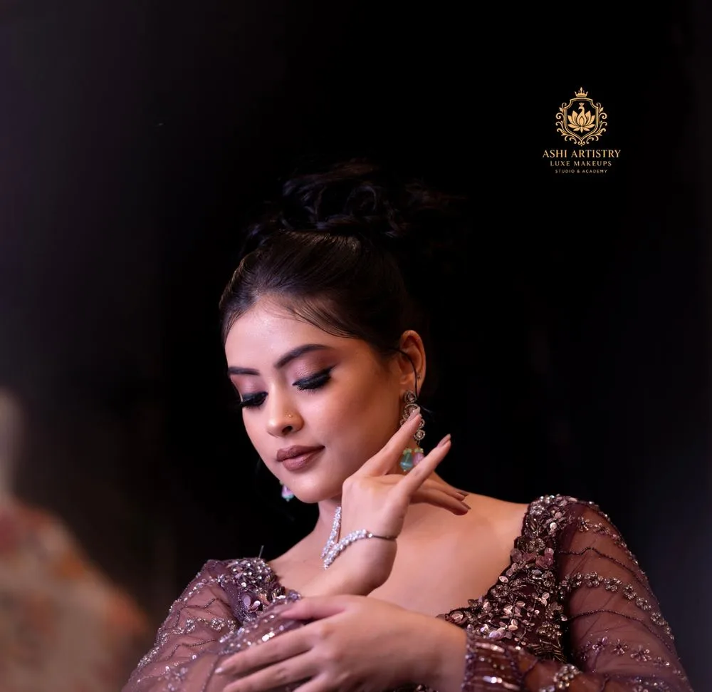 Sculpted updo hairstyle with statement earrings